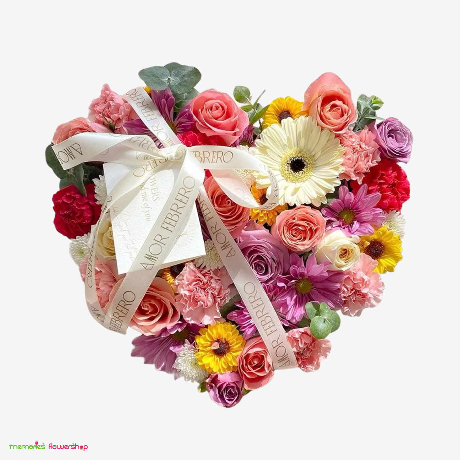 BELLEZA ATEMPORAL: Un corazón elaborado con las flores más frescas de la primavera. Un símbolo de amor eterno y belleza que nunca pasa de moda. Arreglo floral BELLEZA ATEMPORAL - Corazón primaveral con flores de temporada